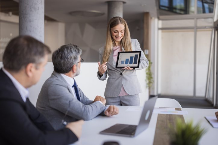 Professional team discussing business growth charts